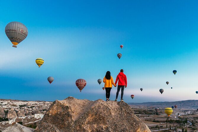 Cappadocia Sunrise Hot Air Balloon Watching Tour w/Transfer - Stop 1 in Goreme: inflation drama and first balloon views